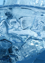 transparent pieces of ice on the surface of the iced nad snowcaped pond. Baikal lake. Photo toned