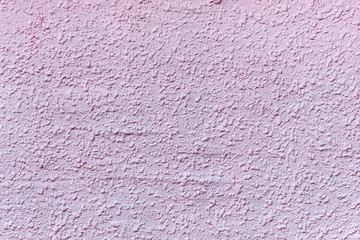 Relief plastered surface in muddy pinkish color. For background and texture.