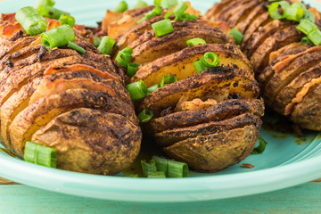 Hasselback potatoes with smoked paprika and bacon.