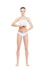 Fototapeta premium Fit, healthy and sporty woman in underwear isolated on white. Sport, fitness, diet, weight loss and healthcare concept.