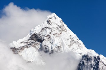 Mount Ama Dablam within clouds, way to Everest base camp