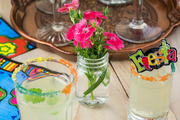 Mexican fiesta table with classic margaritas cocktail.