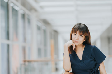 Portrait of beautiful young happy Asian girl smiling indoor