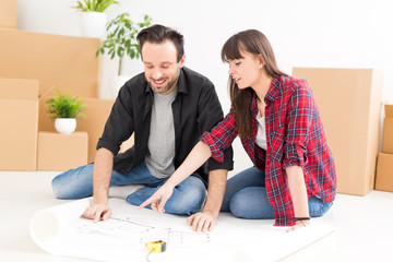 Young people move into a new apartment.