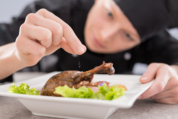 The chef prepares a gourmet meal.