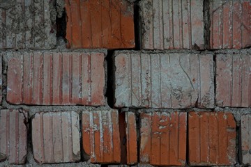 Red bricks background, old cracked wall close up vintage texture