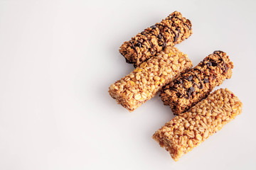 Cereal bars with chocolate isolated on white background.