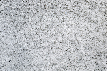Embossed stucco gray surface closeup. For background and texture.