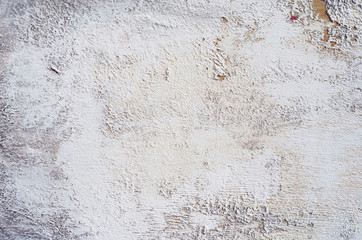 White whitewashed wall. High resolution texture. Grungy Shabby Uneven Painted Plaster In Whiten Facade. Web banner