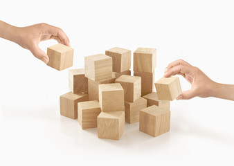 Two hands playing wooden box on isolated background.