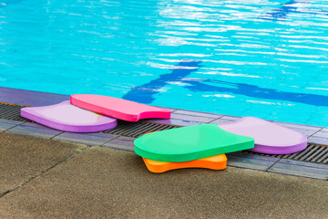 Foam board for the teaching of swimming beside swimming pool