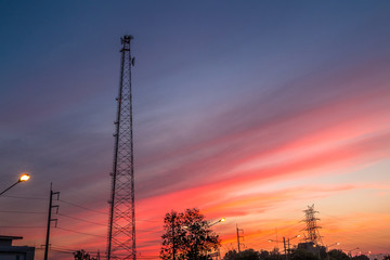 Mobile tower silhouette with twilight evening sky.