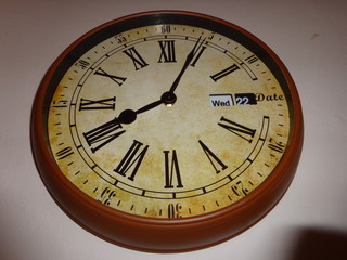 Wall clock with roman numerals