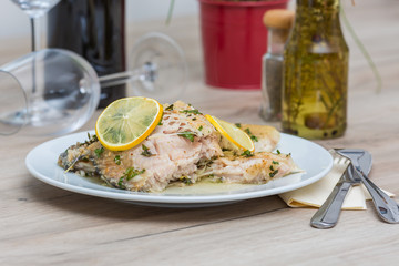Carp serving on white plate