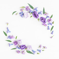Flowers composition. Wreath made of various colorful flowers on white background. Flat lay, top view