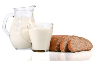 jug and glass of milk with a loaf of bread isolated on white background