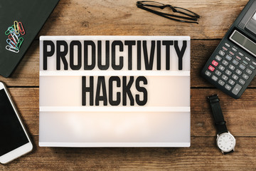 Productivity Hacks on vintage style light box on office deskt op
