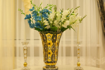 Flowers in gold vase