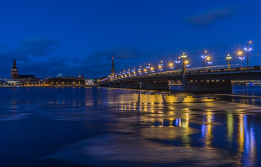 Fototapeta na wymiar Panorama of illuminated bridge in Riga, Latvia