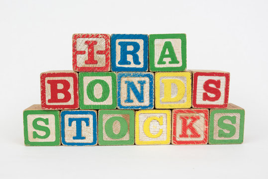 The Word IRA, Bonds and Stocks in Wooden Childrens Blocks