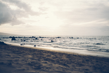 Ocean playing sand beach Hawaii Maui