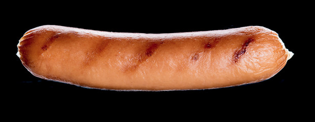 Sausage grilled on a dark background