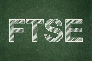 Stock market indexes concept: FTSE on chalkboard background