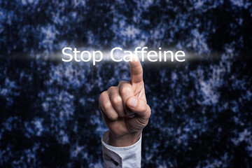 Hand holding a Stop Caffeine Concept