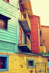 Obraz premium Streets of La Boca in Buenos Aires, Argentina with number of colorful houses and tango teachers.