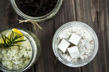 homemade scrubs in jars - coffee, lemon, rosemary, and coconut. spa treatment