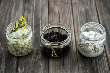 homemade scrubs in jars - coffee, lemon, rosemary, and coconut. spa treatment