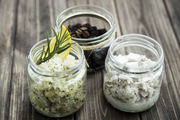 homemade scrubs in jars - coffee, lemon, rosemary, and coconut. spa treatment