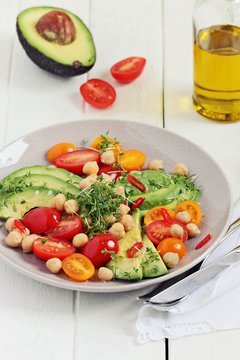 Detox avocado salad with chick pea and tomatoes.Super foods and clean eating concept.Selective focus