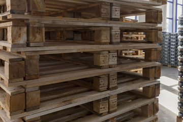 on a pile of wooden pallets