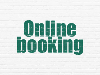 Tourism concept: Online Booking on wall background