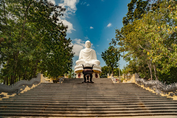 Statue of the Buddha against the blue sky. Temple of the Buddha. Vietnam, Nha Trang, Pagoda. - 138749326