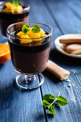 Chocolate pudding topped with orange pieces