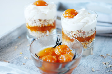 Oats layered with spicy apricot jam. Healthy food concept.