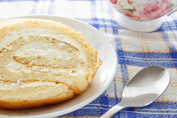 Homemade sponge roll with cottage cheese cream 