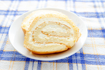Homemade sponge roll with cottage cheese cream 