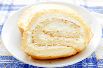 Homemade sponge roll with cottage cheese cream 