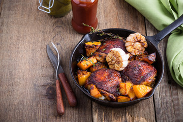 Roasted  chicken thighs with with butternut, thyme and garlic