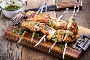 Grilled chicken skewers with chimichurri sauce