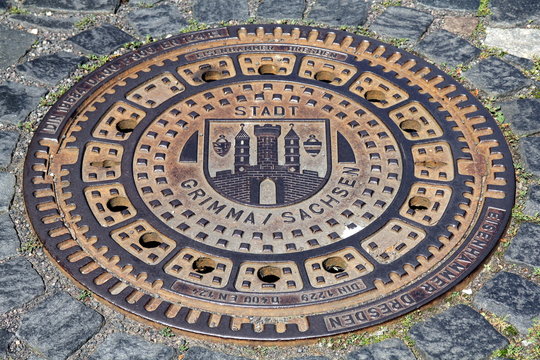 Manhole cover in the city of Grimma in Saxony (Germany)