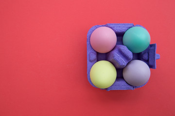 Easter eggs box on red background