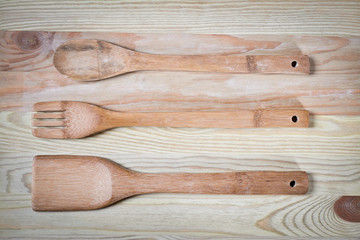 different wooden spoons on the blue table