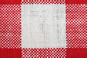 Fototapeta na wymiar red and white tablecloth macro
