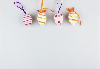 Happy easter greetings card with coloured eggs isolated on a white background