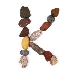 letter k from stone isolated on white