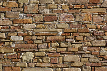Laying of natural stone. Detail of a wall. Background
